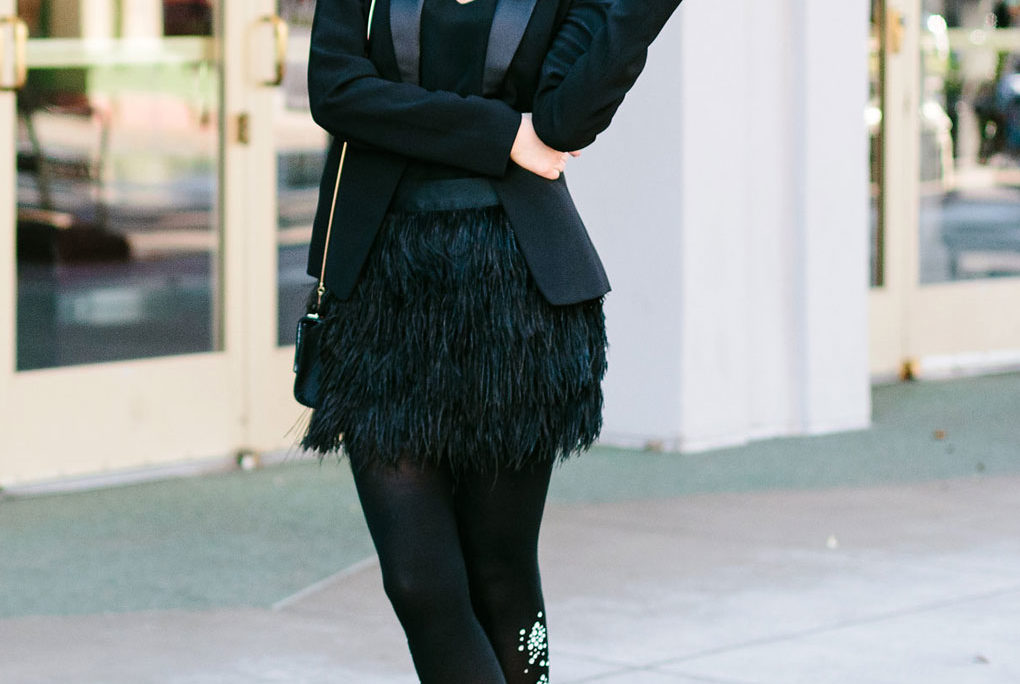 Sydne Style shows how to wear the feather skirt trend with a tuxedo jacket and tights
