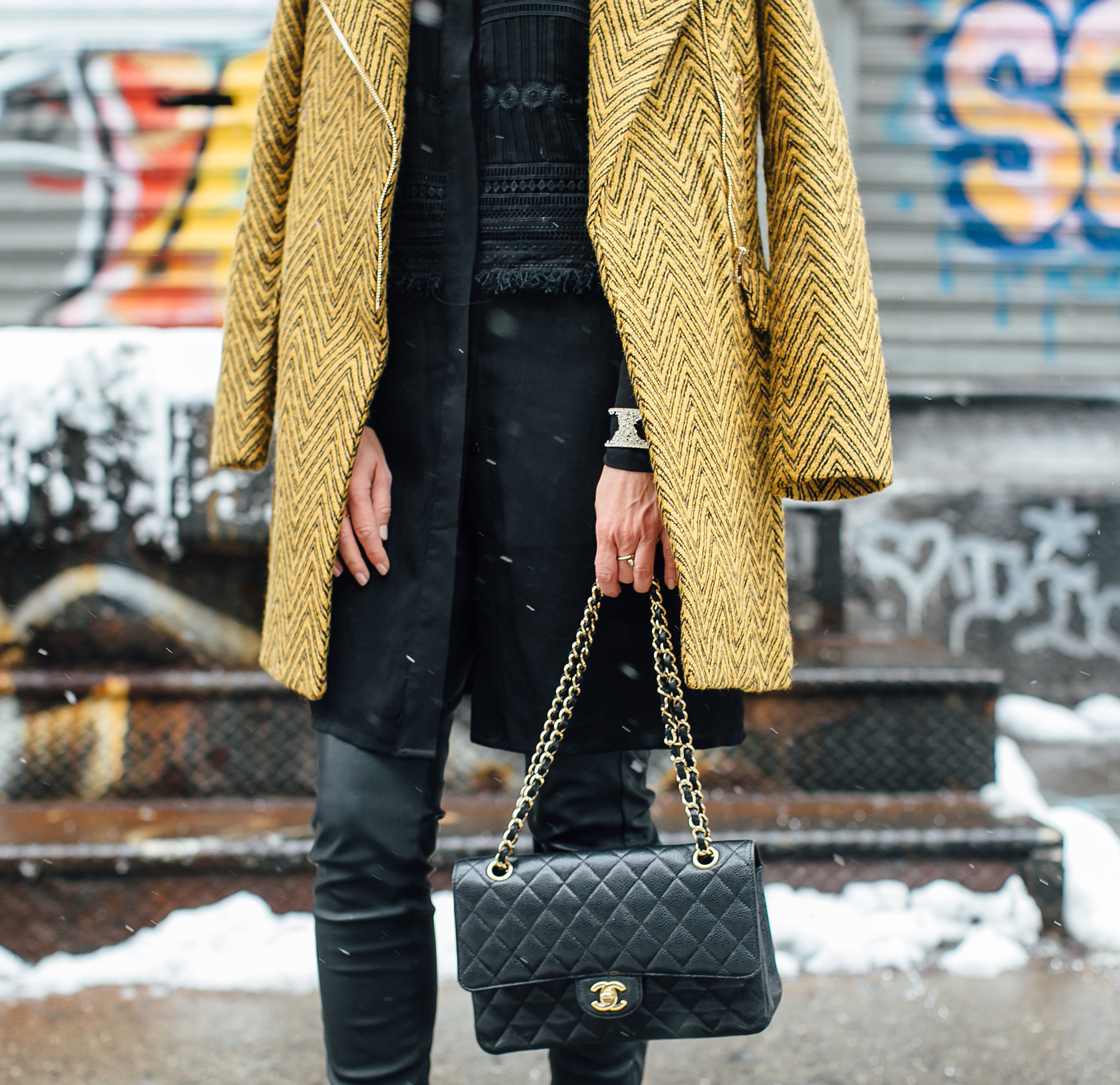 Sydne Style wears Chanel medium flap bag at new york fashion week