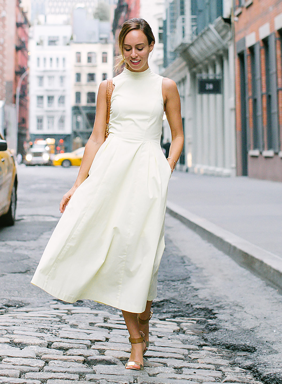 Sydne Style shows how to wear pastel for spring in lemon yellow dress Sydne Style