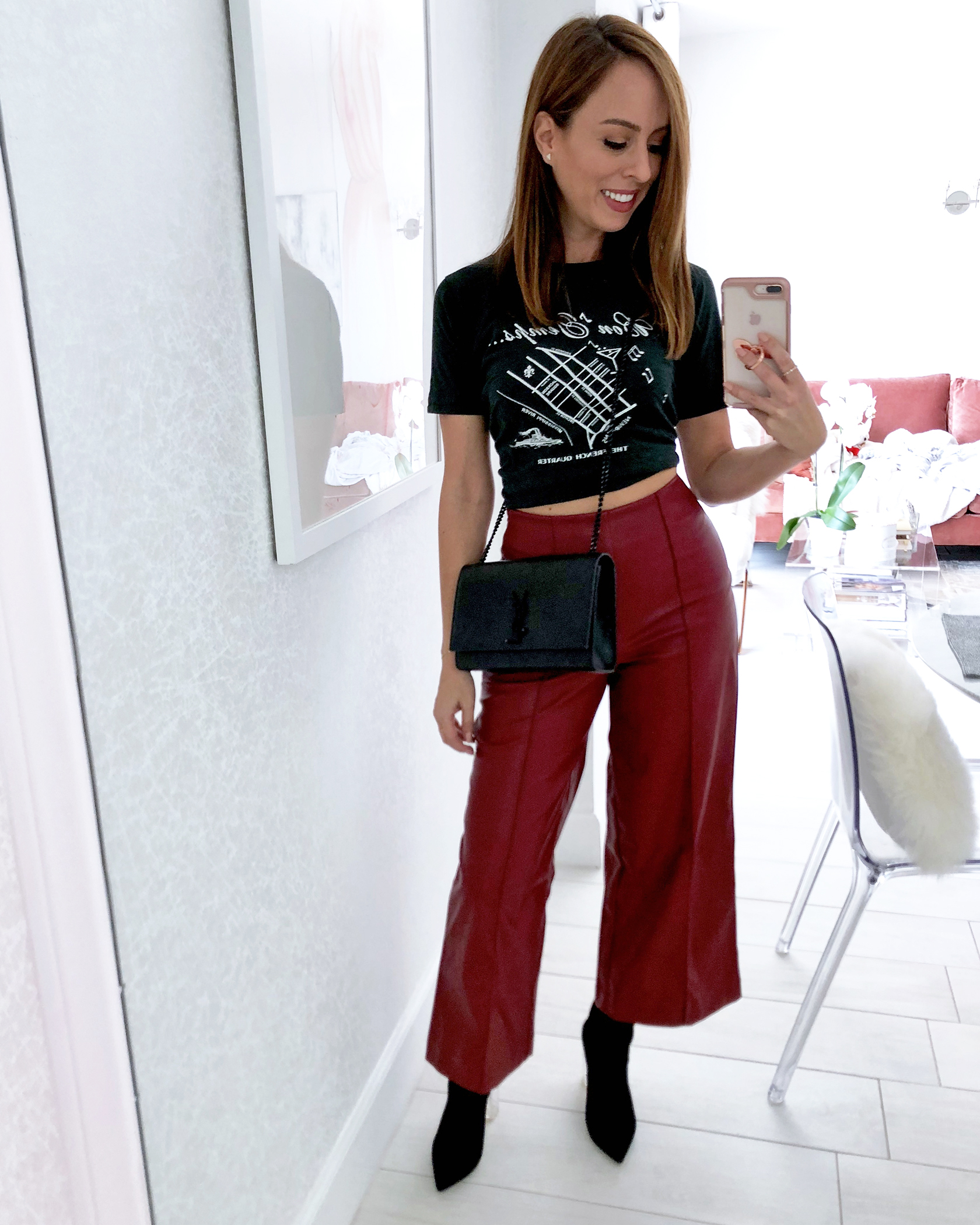 Sydne Style wears cropped leather pants and graphic tee for fall outfit ideas