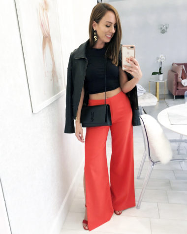 Sydne Style wears red wide leg pants 