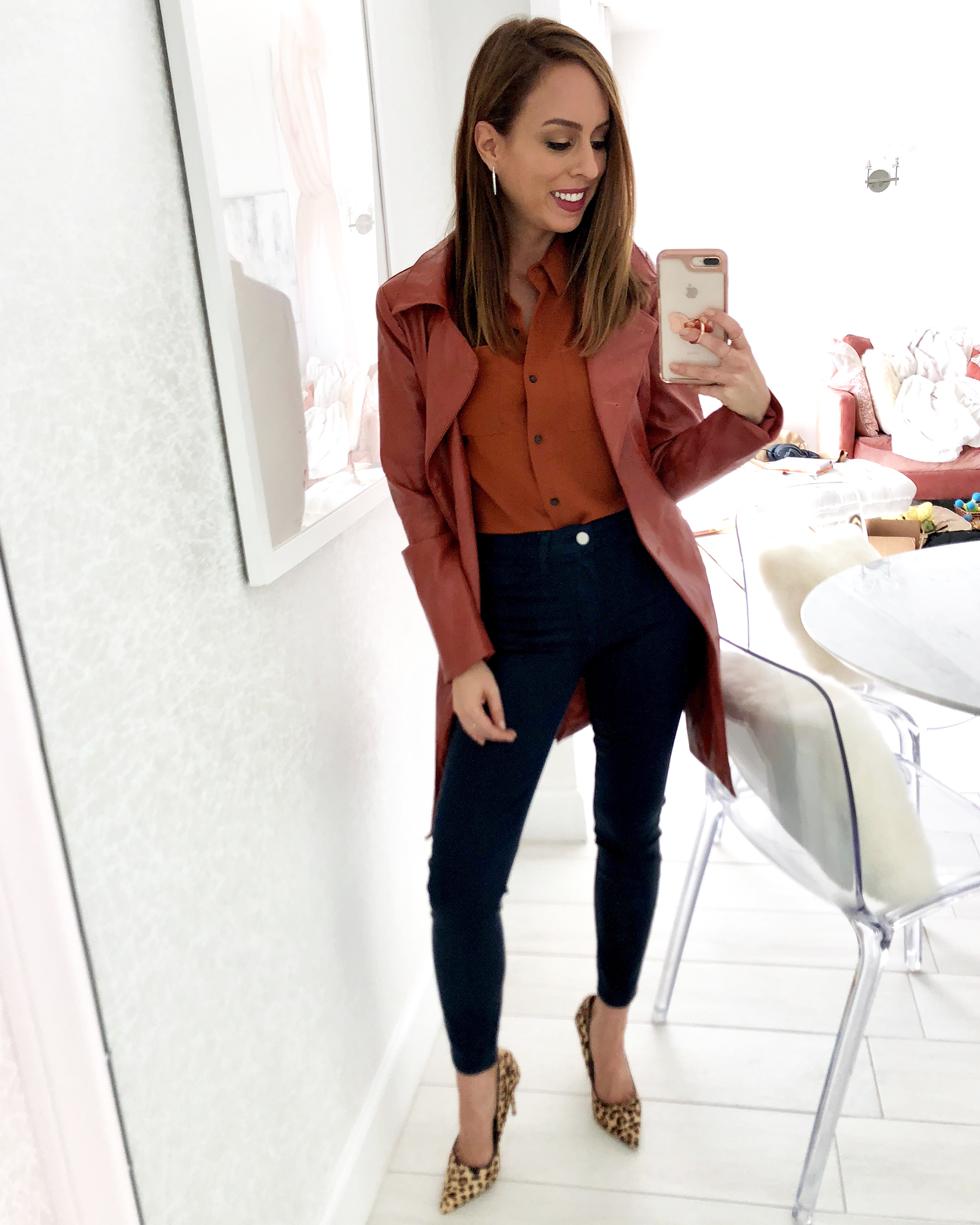 Sydne Style shows fall outfit ideas in leather trench and coated skinny jeans