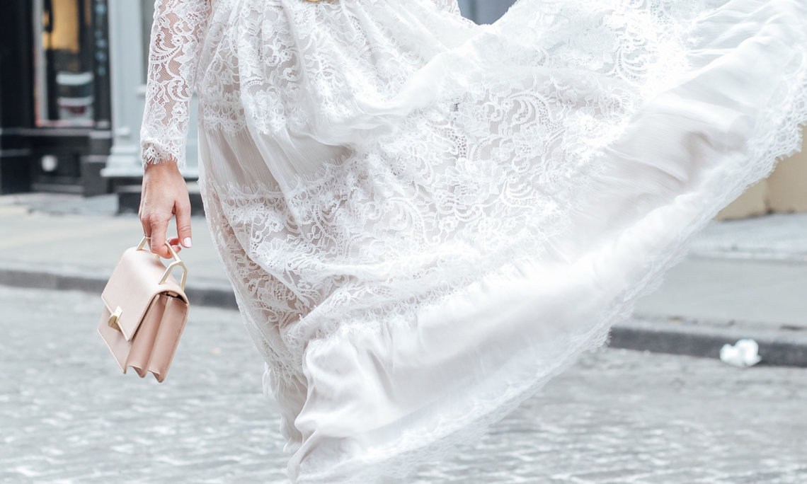 Sydne Style shows how to wear a lace dress with boots for spring style