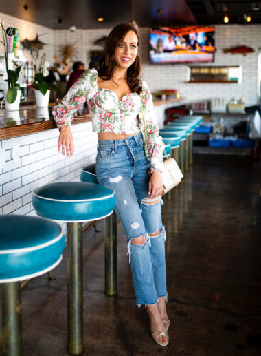Sydne Style wears floral top and high 