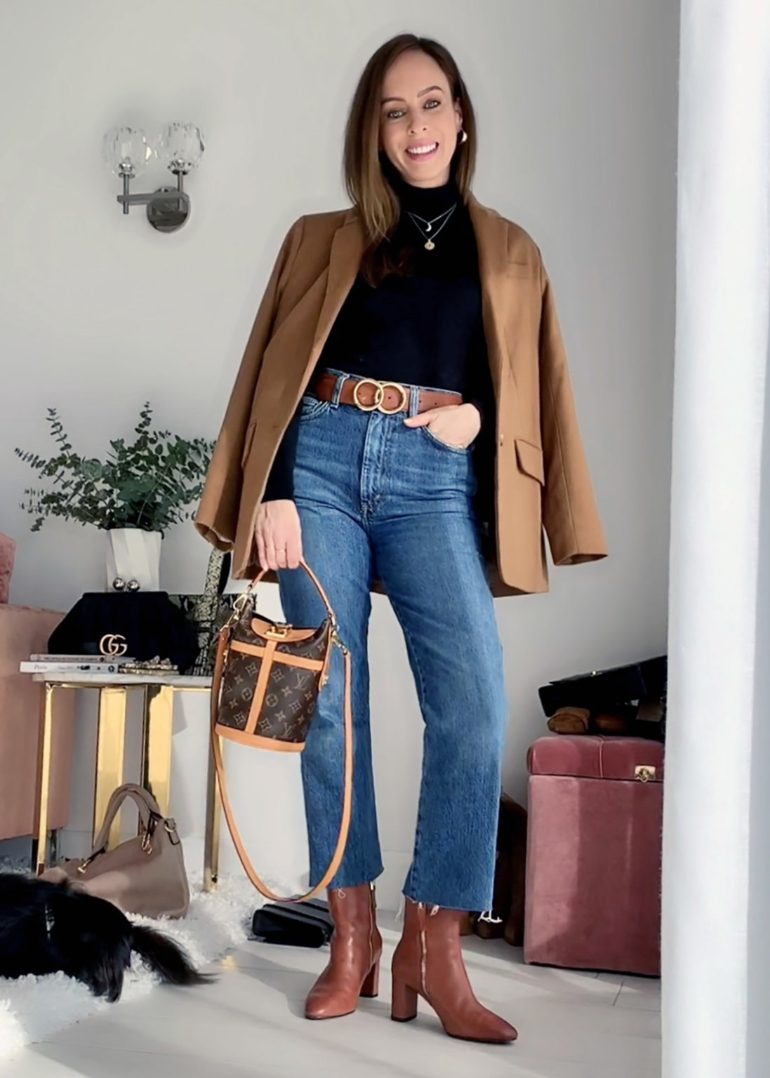 Sydne Style shows how to wear a turtleneck with jeans and a blazer for