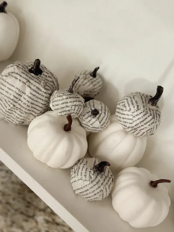 DIY book page pumpkins made with Mod Podge for black and white Halloween decor
