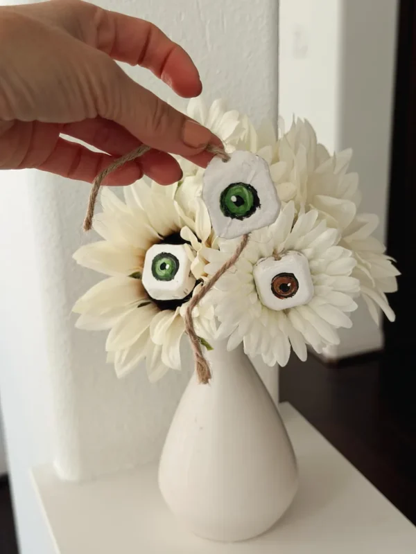 How to attach egg carton eyeballs to faux flowers with twine