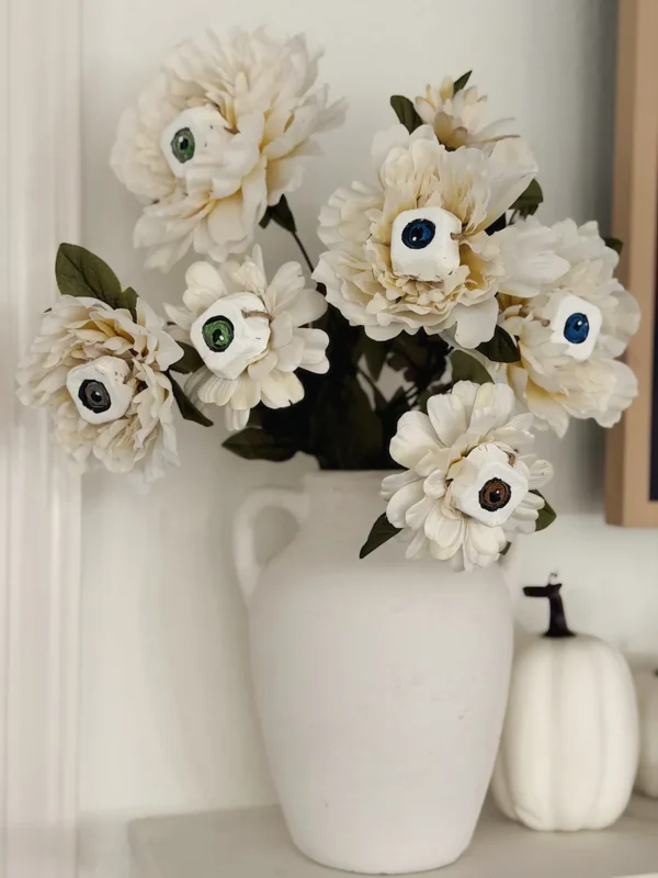 White faux peonies with egg carton eyeballs, easy Halloween flower DIY